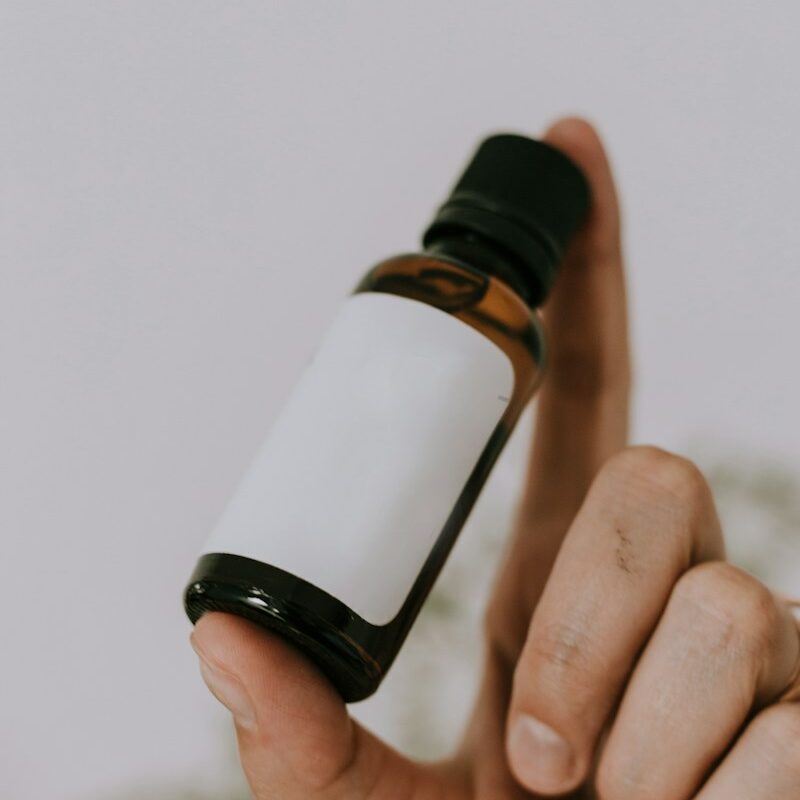 white and brown glass bottle